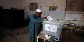 A man casts his ballot during the parliamentary election, in Pikine, on the outskirts of Dakar, Senegal, July 31, 2022.