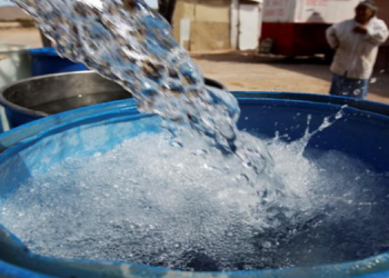 [File image] : Water being poured into a container.