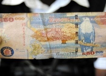 A man displays a 50,000 Kwacha note in Lusaka, in a file photo.
