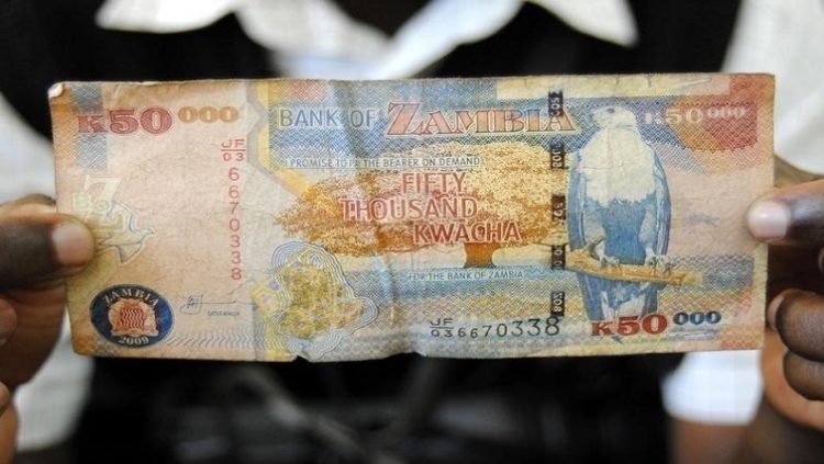 A man displays a 50,000 Kwacha note in Lusaka, in a file photo.