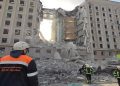 Rescuers work at a site of the regional administration building hit by cruise missiles, as Russia's attack on Ukraine continues, in Mykolaiv.