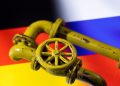 3D printed Natural Gas Pipes are placed on displayed German and Russian flags in this illustration taken, January 31, 2022. REUTERS/Dado Ruvic/File Photo