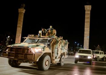 Members of the military personnel arrive to take part in a parade calling for parliamentary and presidential election, at Martyr's square in Tripoli, Libya