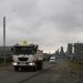 Trucks leave an Anglo American Platinum (AMPLATS) processing plant near Rustenburg in this October 12, 2012.