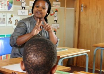 Ayanda Ntukwana teaching sign language.