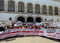 Tunisian judges carry banners during a protest against a decision by President Kais Saied to sack many of them.