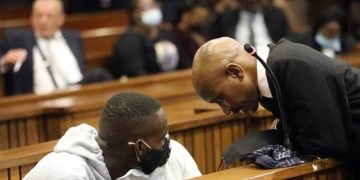 Advocate Malesela Teffo speaking to one of the defendants in the Senzo Meyiwa murder trial at the High Court in Pretoria.