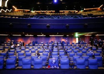 (File Image) People take their seats inside the Odeon Luxe Leicester Square cinema, on the opening day of the film "Tenet", amid the coronavirus disease (COVID-19) outbreak, in London, Britain.