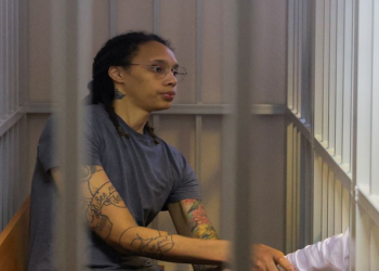 U.S. basketball player Brittney Griner, who was detained at Moscow's Sheremetyevo airport and later charged with illegal possession of cannabis, sits inside a defendants' cage after the court's verdict in Khimki outside Moscow, Russia August 4, 2022.