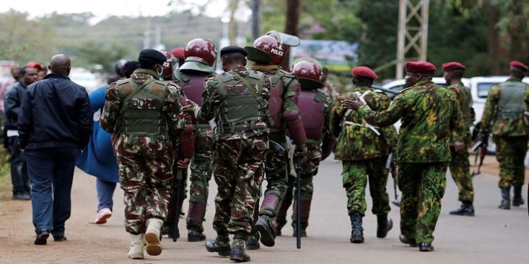 Riot police officers control unaccredited people as they secure the Independent Electoral and Boundaries Commission (IEBC) National tallying centre at the Bomas of Kenya, in Nairobi, Kenya August 14, 2022.