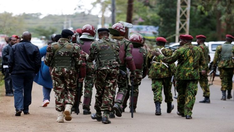 Riot police officers control unaccredited people as they secure the Independent Electoral and Boundaries Commission (IEBC) National tallying centre at the Bomas of Kenya, in Nairobi, Kenya August 14, 2022.