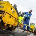 Workers seen fixing potholes in South Africa at the Operation Vala Zonke campaign launch.