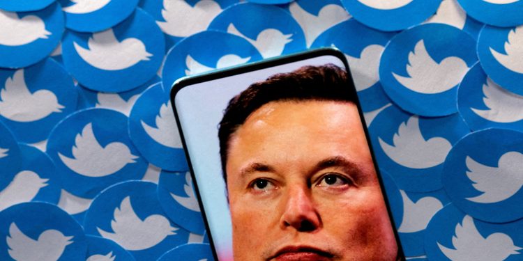 [File Image] An image of Elon Musk is seen on smartphone placed on printed Twitter logos in this picture illustration taken April 28, 2022.