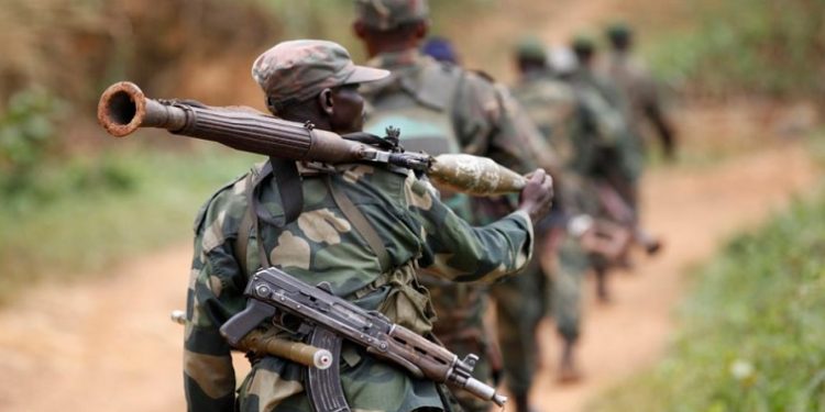 Democratic Republic of Congo military personnel (FARDC) patrol against the Allied Democratic Forces (ADF) and the National Army for the Liberation of Uganda (NALU) rebels near Beni in North-Kivu province, December 31, 2013.