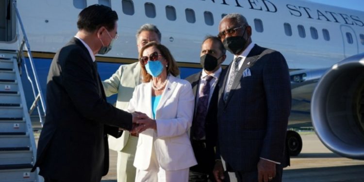 US House of Representatives Speaker Nancy Pelosi talks with Taiwan Foreign Minister Joseph Wu before boarding a plane at Taipei Songshan Airport in Taipei, Taiwan August 3, 2022.