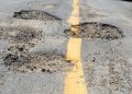 File image: Potholes seen on a road.