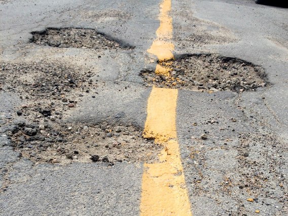 File image: Potholes seen on a road.