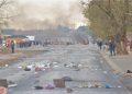 A road littered with bricks, debris and burning tyres in Tembisa, 03 August 2022.