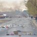 A road littered with bricks, debris and burning tyres in Tembisa, 03 August 2022.