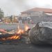 A fire burns in the middle of the road during the Tembisa protests.