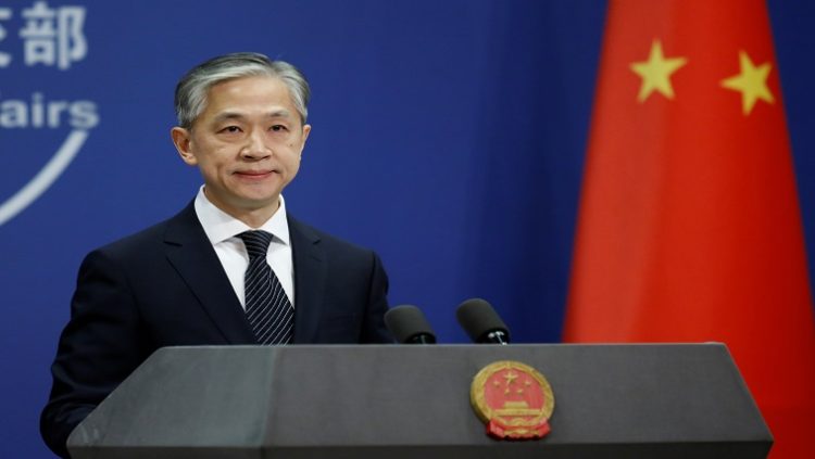 FILE PHOTO: Chinese Foreign Ministry spokesman Wang Wenbin attends a news conference in Beijing, China November 9, 2020. REUTERS/Tingshu Wang/File Photo