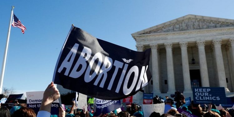 Protestors stand in front of th US Supreme Court following a ruling on abortion rights.