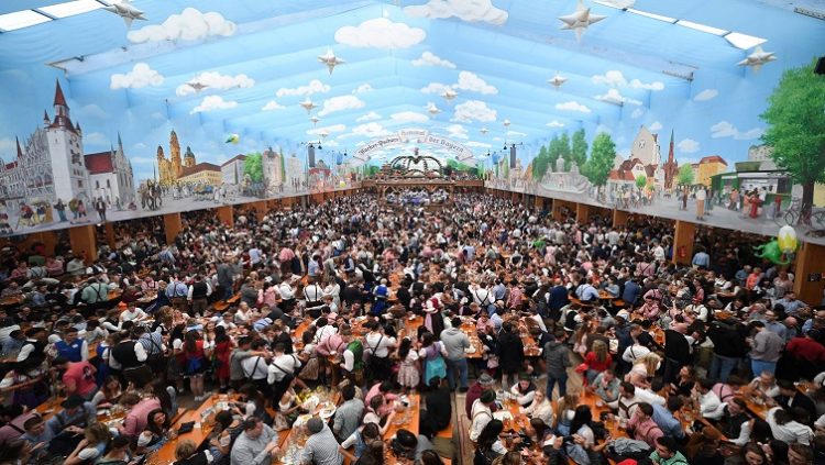 Visitors attend the official opening of the world's largest beer festival, the 187th Oktoberfest in Munich, Germany, September 17, 2022.