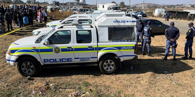 File | Police at the tavern shooting scene