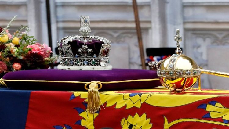 The coffin of Queen Elizabeth II with the Imperial State Crown resting on top is carried into Westminster Abbey on September 19, 2022
