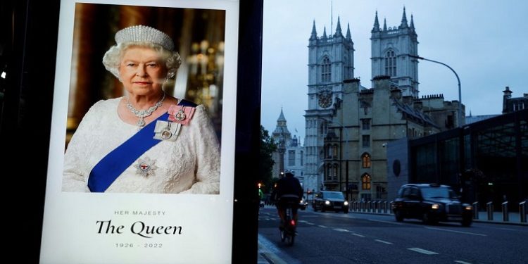 A portrait of Queen Elizabeth is displayed at a bus stop outside Westminster Abbey, following the passing of Queen Elizabeth, in London, Britain, September 9, 2022.