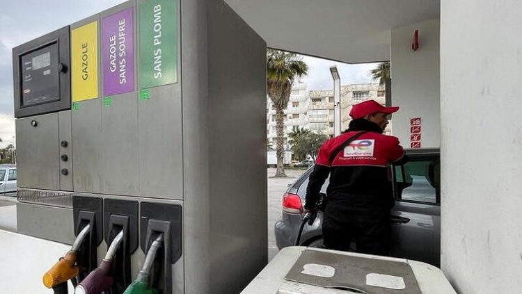 A worker fills up a car with fuel at a gas station in Tunis, Tunisia March 21, 2022.