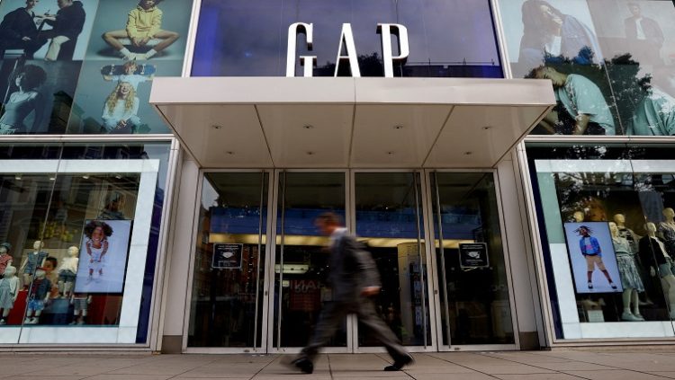 FILE PHOTO: A man walks past a Gap store on Oxford Street in London, Britain, July 1, 2021.