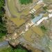 An aerial view of a bridge destroyed by a river flood is seen in the aftermath of Hurricane Fiona in Guayama, Puerto Rico September 20, 2022.