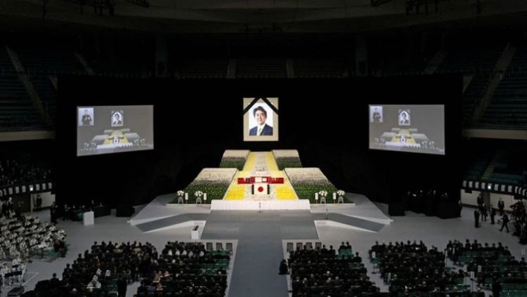 A portrait of Shinzo Abe hangs above the stage during the state funeral for Japan's former prime minister Shinzo Abe on September 27, 2022 at the Budokan in Tokyo, Japan