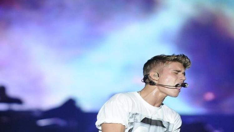 Canadian pop singer Justin Bieber performs during his "Believe" concert at the Olimpic Stadium in Santo Domingo October 22, 2013.