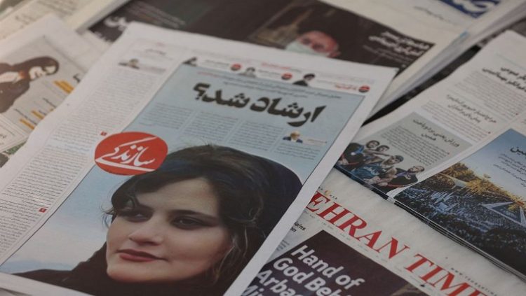 A newspaper with a cover picture of Mahsa Amini, a woman who died after being arrested by the Islamiv republic’s “morality police” is seen in Tehran, Iran September 18, 2022.