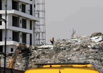 [File Image] A rescue member works on the debris as search and rescue efforts continue at the site of a collapsed building in Ikoyi, Lagos, Nigeria November 2, 2021.