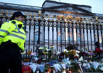 Flowers placed by mourners outside Buckingham Palace in London.