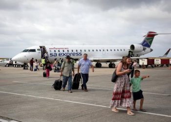 Passengers disembark from a SA Express flight