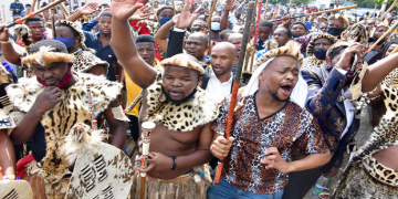 AmaZulu carrying traditional spears and shields