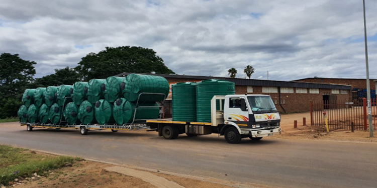 A truck transporting water tanks.