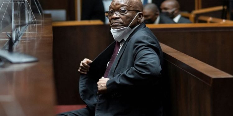 Former South African President Jacob Zuma sits in court during his corruption trial in Pietermaritzburg, South Africa, October 26, 2021.