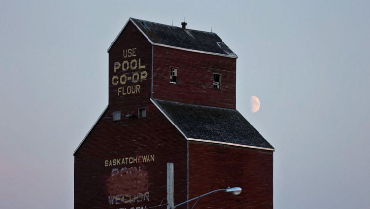 The moon rises behind a grain elevator as police conducted a manhunt, after multiple people were killed and injured in a stabbing spree in Weldon, Saskatchewan, Canada. September 4, 2022