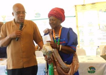 Home Affiars Minister Dr Aaron Motsoaledi hands over ID card to centenarian, 103 year old Gogo Malesela Mashilo at Letebejane Village in Limpopo.