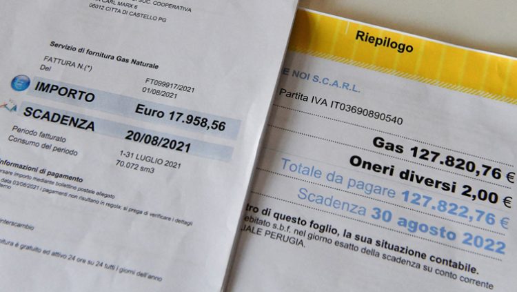 Commercial Director Lorenzo Giornelli shows the gas bill for August 2021 and August 2022, at a ceramics factory where the workers start their shifts before dawn to optimise sunlight and save energy, in Citta di Castello, Italy, August 30, 2022.