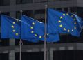 European Union flags fly outside the Commission headquarters in Brussels Belgium