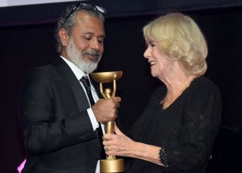 Britain's Queen Consort Camilla presents winner Shehan Karunatilaka with trophy for "The Seven Moons of Maali Almeida" at the Booker Prize for Fiction 2022 awards ceremony, in London, Britain, October 17, 2022