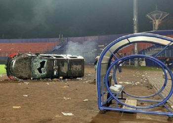 A damaged car is pictured following a riot after the league BRI Liga 1 football match between Arema vs Persebaya at Kanjuruhan Stadium, Malang, East Java province, Indonesia, October 2, 2022.