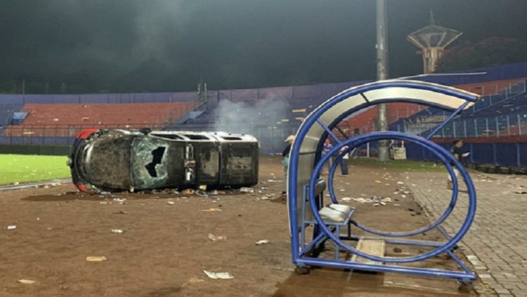A damaged car is pictured following a riot after the league BRI Liga 1 football match between Arema vs Persebaya at Kanjuruhan Stadium, Malang, East Java province, Indonesia, October 2, 2022.