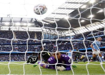 Manchester City's Erling Braut Haaland celebrates scoring their fourth goal as Southampton's Gavin Bazunu reacts.